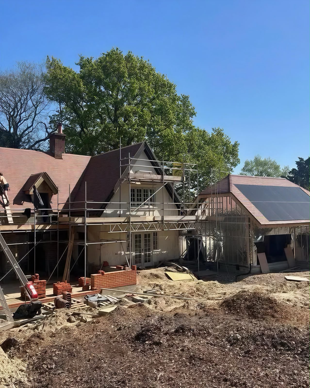 Home addition under construction with scaffolding